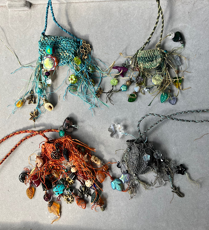 Four Seasons Knotless Netted Pouch Set Widdershins, starting upper right, Spring, Summer, Autumn, Winter